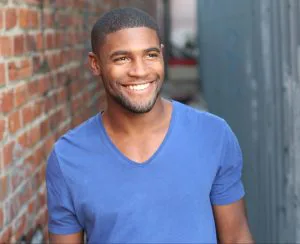 Man in Blue Shirt With A Perfect White Smile Outside Grand Rapids MI Dentists