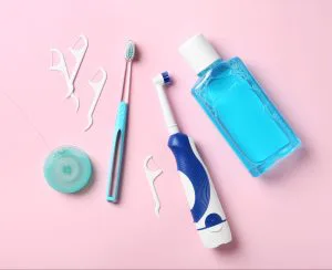 Toothbrush with floss and mouthwash from Grand Rapids dentists